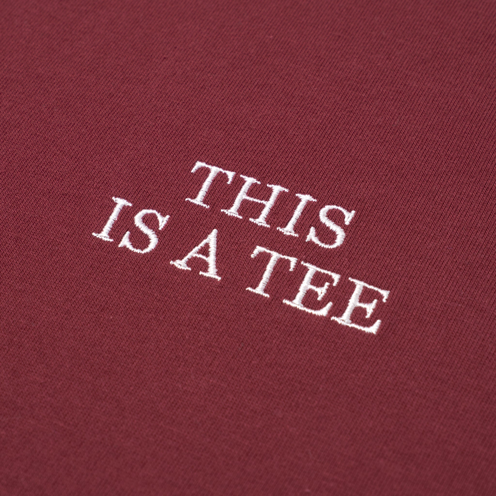 "THIS IS A TEE" TEE BURGUNDY(ティスイズアティーティーバーガンディー)|byeA.(バイエー)OFFICIAL ONLINE STORE