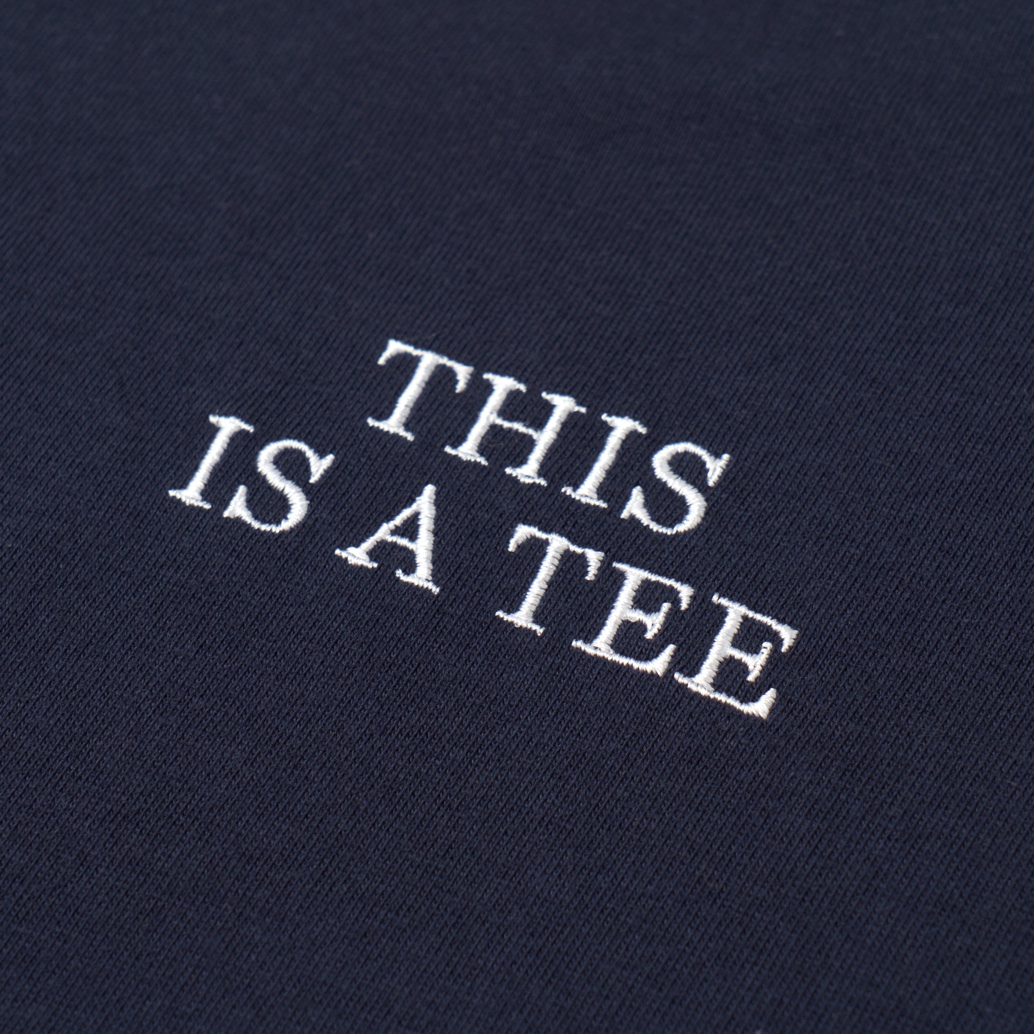 "THIS IS A TEE" TEE NAVY(ティスイズアティーティーネイビー)|byeA.(バイエー)OFFICIAL ONLINE STORE